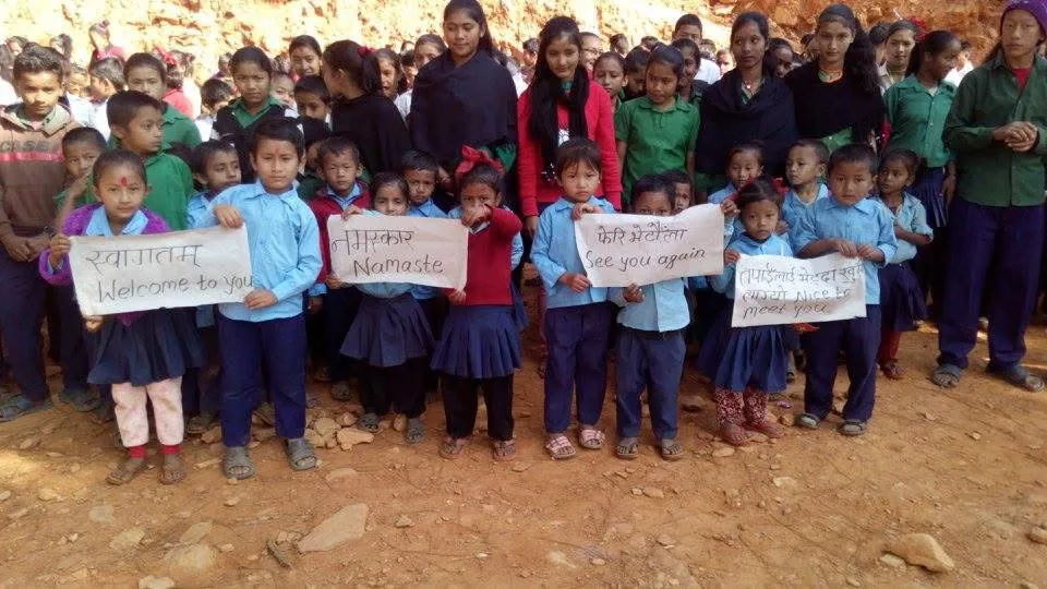 Students in Nepal working together on laptops