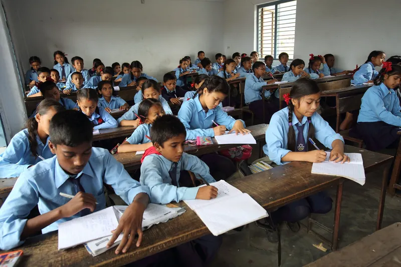 Students working at their desks in a classroom